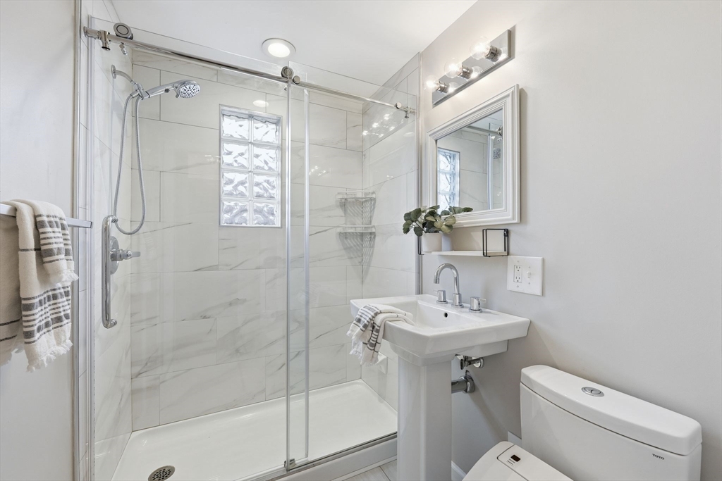 104 Chateaugay Street Chicopee, MA 01020 - Photo 23 of 38 a bathroom with a sink toilet and shower