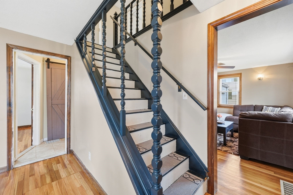 104 Chateaugay Street Chicopee, MA 01020 - Photo 26 of 38 a view of an entryway with wooden floor and stairs