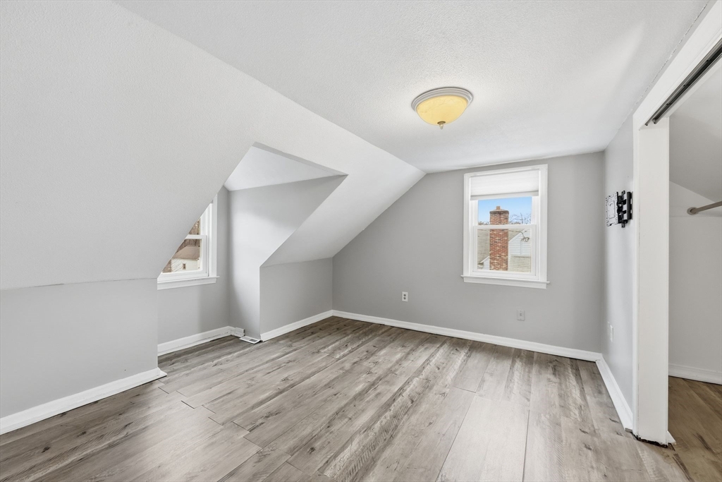 104 Chateaugay Street Chicopee, MA 01020 - Photo 28 of 38 wooden floor in an empty room with a window