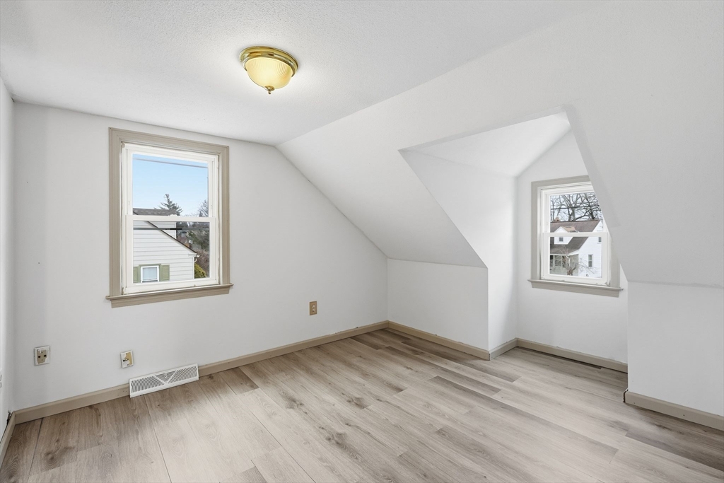104 Chateaugay Street Chicopee, MA 01020 - Photo 30 of 38 a view of a room with wooden floor and window