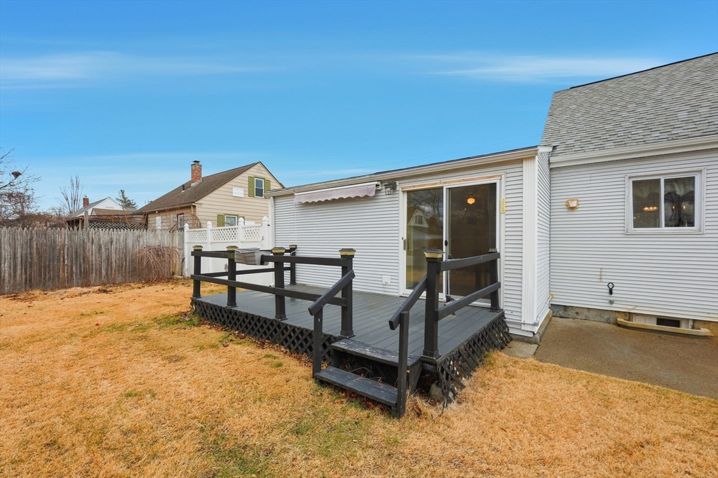 104 Chateaugay Street Chicopee, MA 01020 - Photo 35 of 38 a view of a house with wooden floor and wooden fence