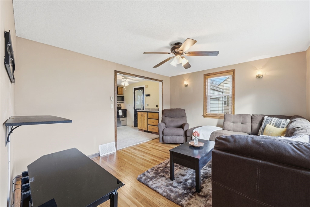 104 Chateaugay Street Chicopee, MA 01020 - Photo 7 of 38 a living room with furniture and wooden floor