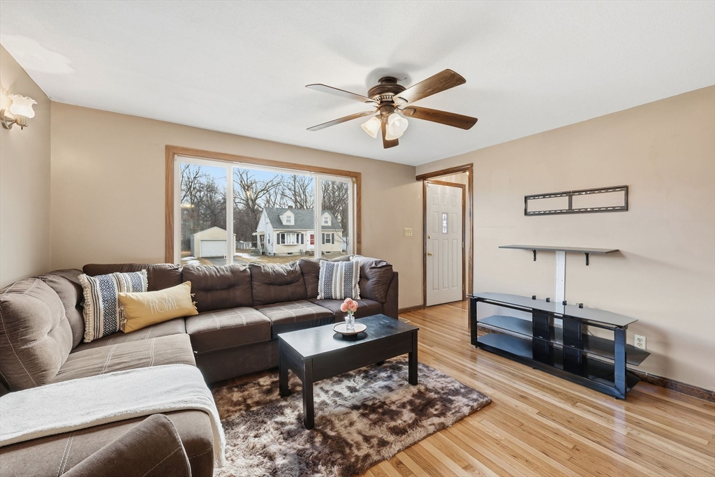 104 Chateaugay Street Chicopee, MA 01020 - Photo 9 of 38 a living room with furniture and a large window