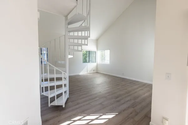 a view of livingroom with wooden floor and windows