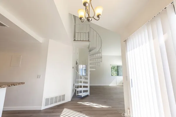 a view of entryway with wooden floor