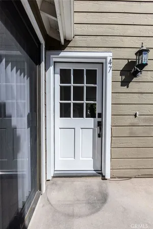 a view of front door and a window