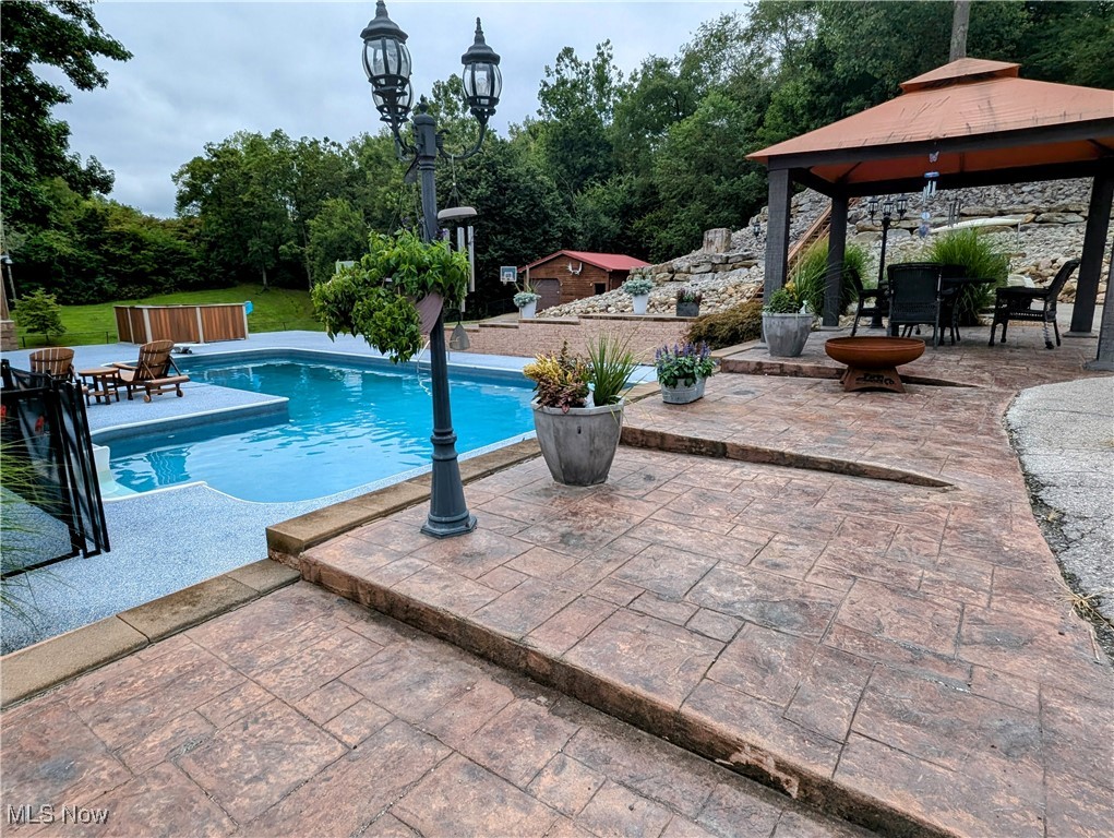46136 Carlisle Road Lisbon, OH 44432 - Photo 11 of 48 View of pool featuring a patio area and a gazebo