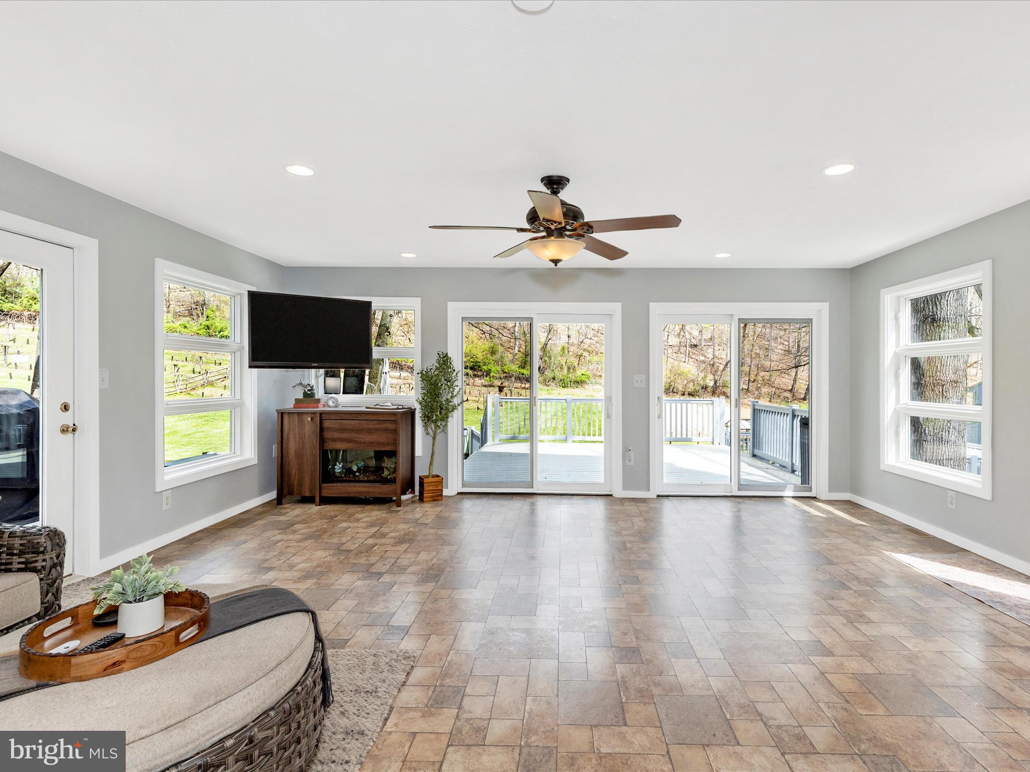 111 Bachmans Valley Road Westminster, MD 21158 - Photo 13 of 97 a view of a livingroom with a fireplace a window and a couch
