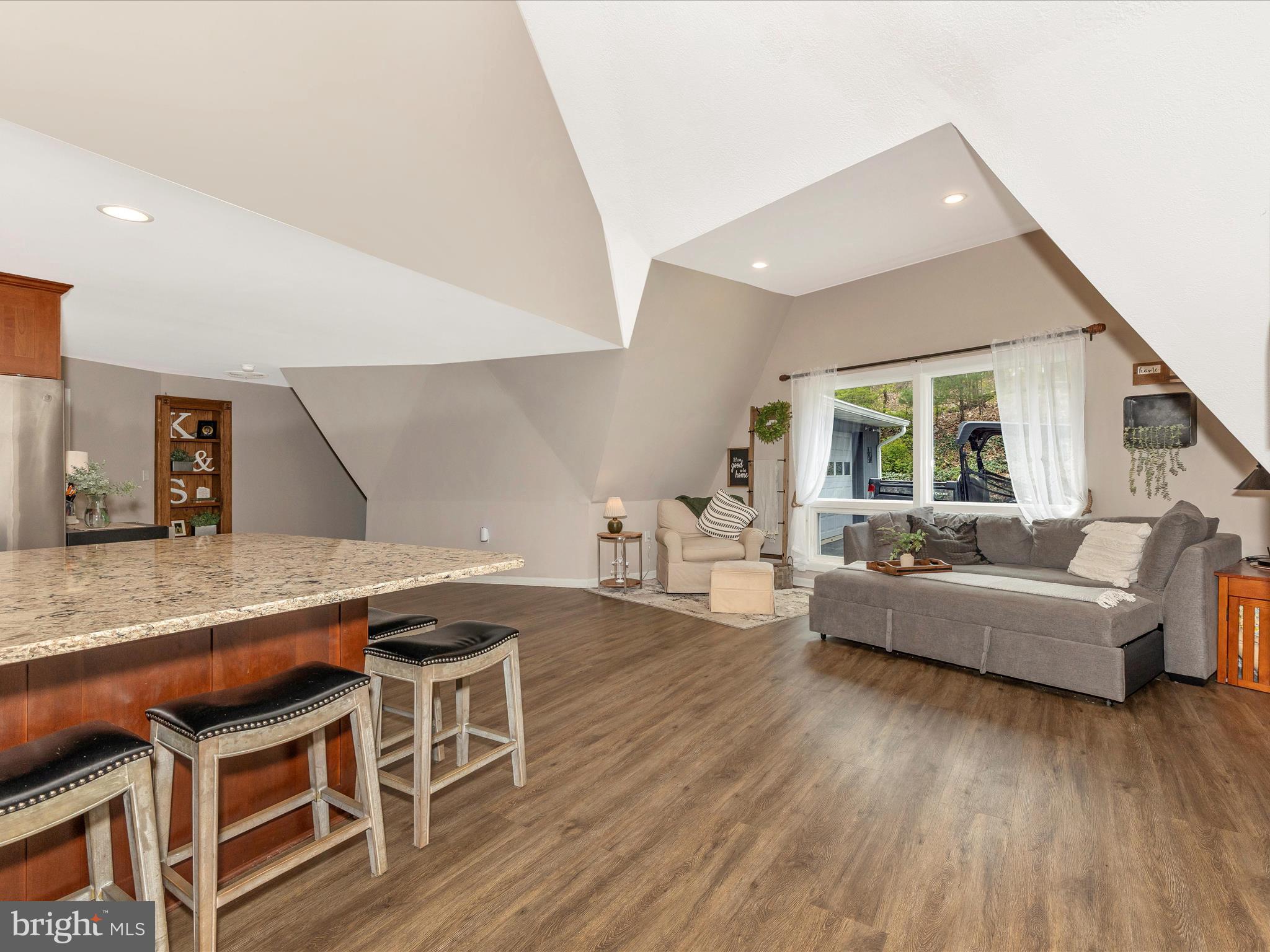 111 Bachmans Valley Road Westminster, MD 21158 - Photo 20 of 97 a living room with furniture a wooden floor and a large window