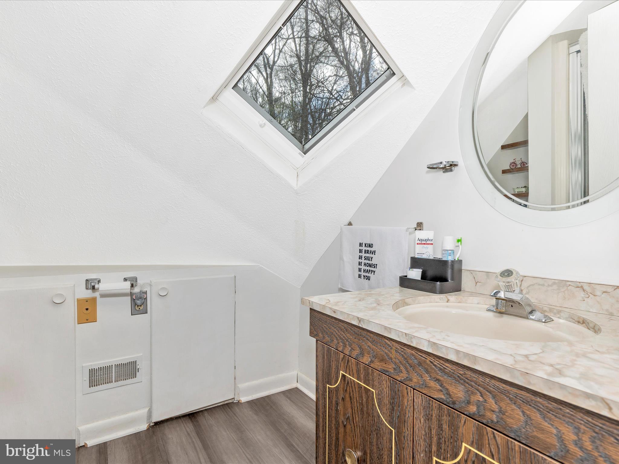 111 Bachmans Valley Road Westminster, MD 21158 - Photo 36 of 97 a bathroom with a sink and a mirror