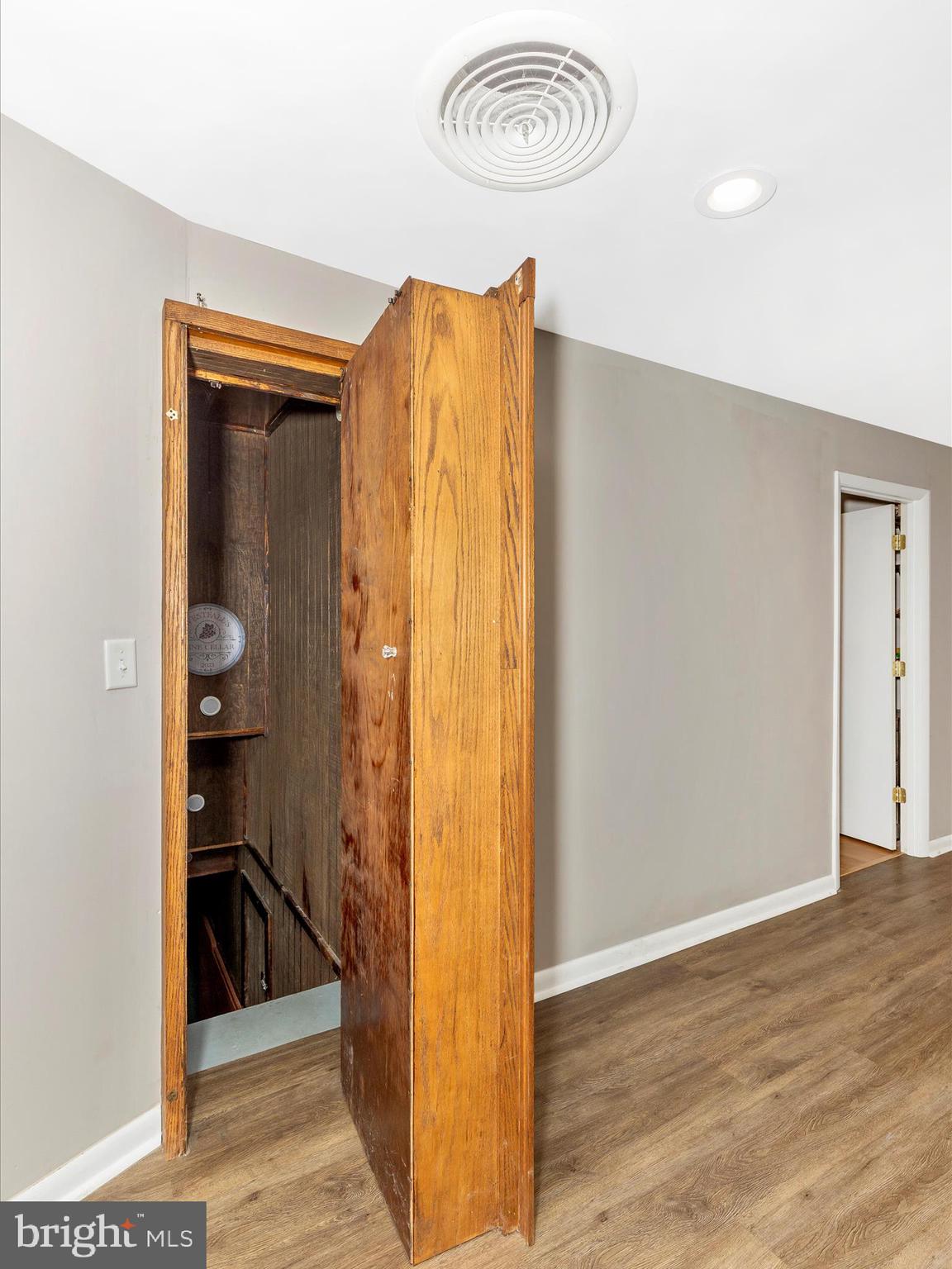 111 Bachmans Valley Road Westminster, MD 21158 - Photo 59 of 97 a view of a hallway with wooden floor and dining room