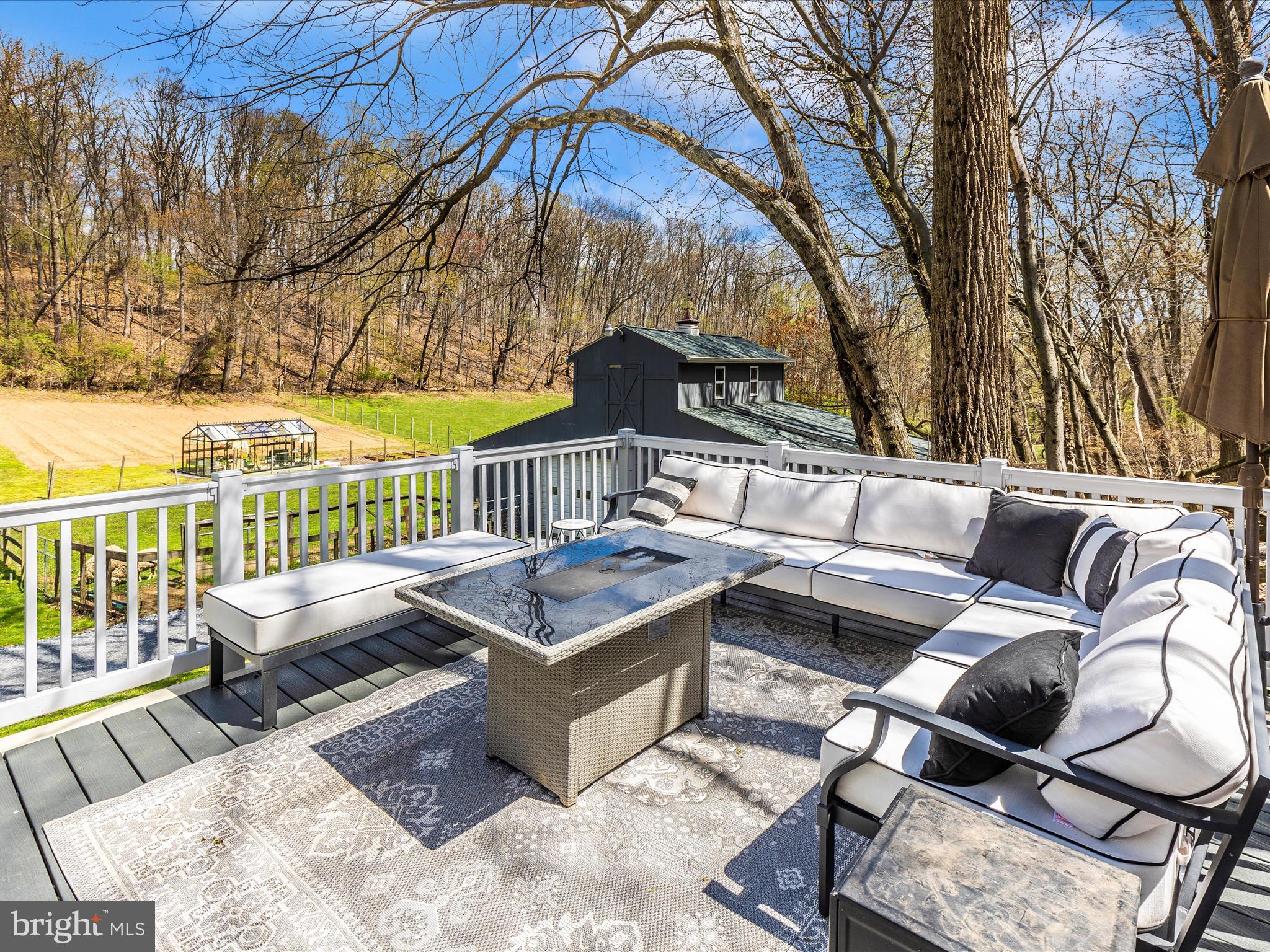 111 Bachmans Valley Road Westminster, MD 21158 - Photo 64 of 97 a roof deck with couches and wooden fence