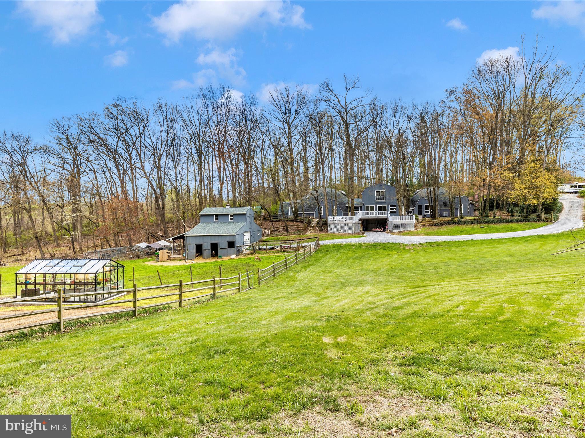 111 Bachmans Valley Road Westminster, MD 21158 - Photo 78 of 97 a view of a swimming pool with a bench and trees in the background