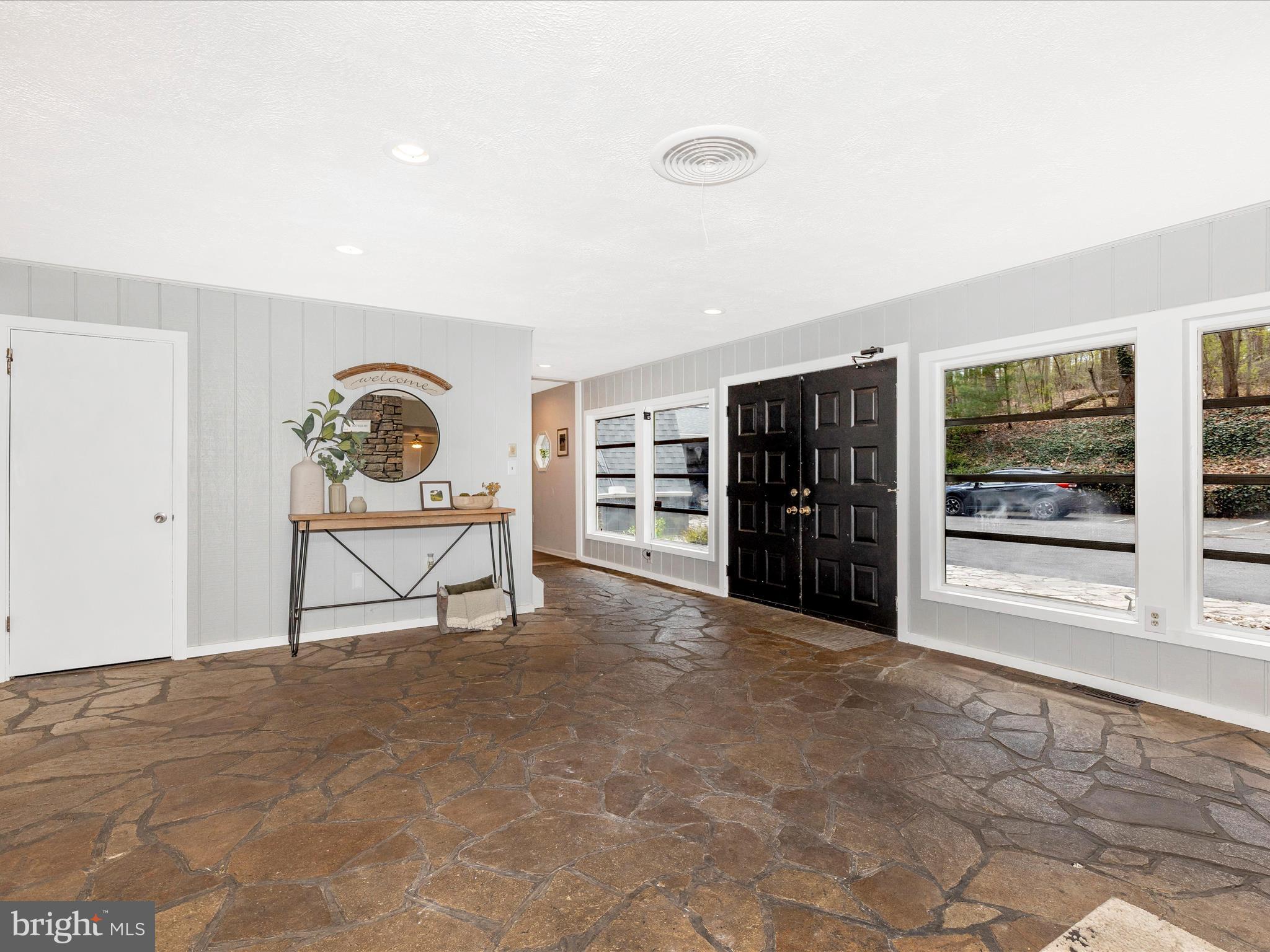 111 Bachmans Valley Road Westminster, MD 21158 - Photo 9 of 97 a view of an empty room with furniture and window