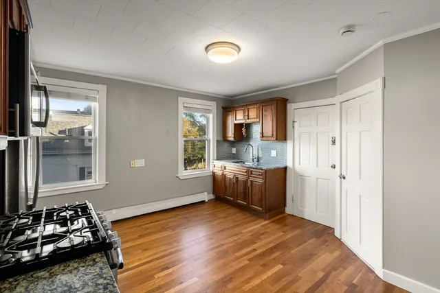 a room with furniture window and wooden floor