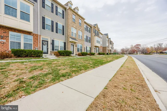 a view of a brick building with many windows