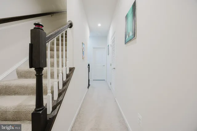 a view of a livingroom with stairs