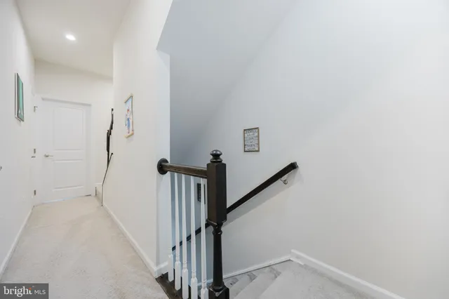 a view of a hallway with a white walls