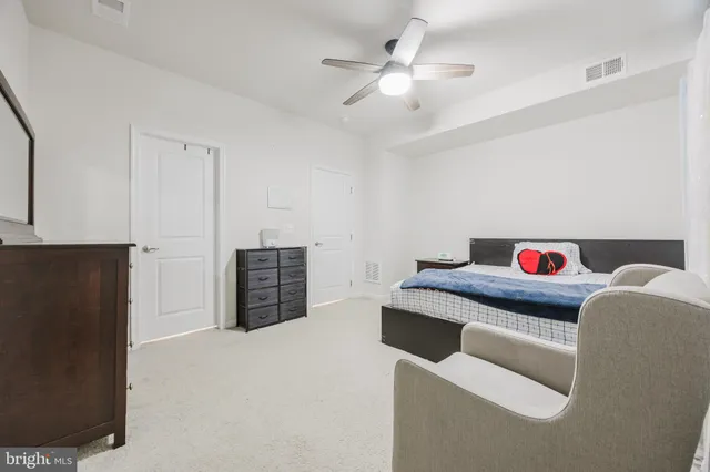 a living room with furniture and a kitchen