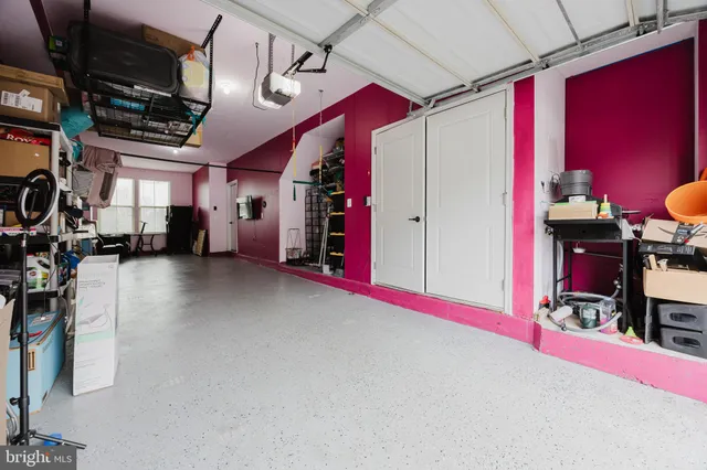 a empty room with furniture and a flat screen tv