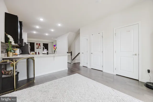 a view of kitchen with furniture and a refrigerator