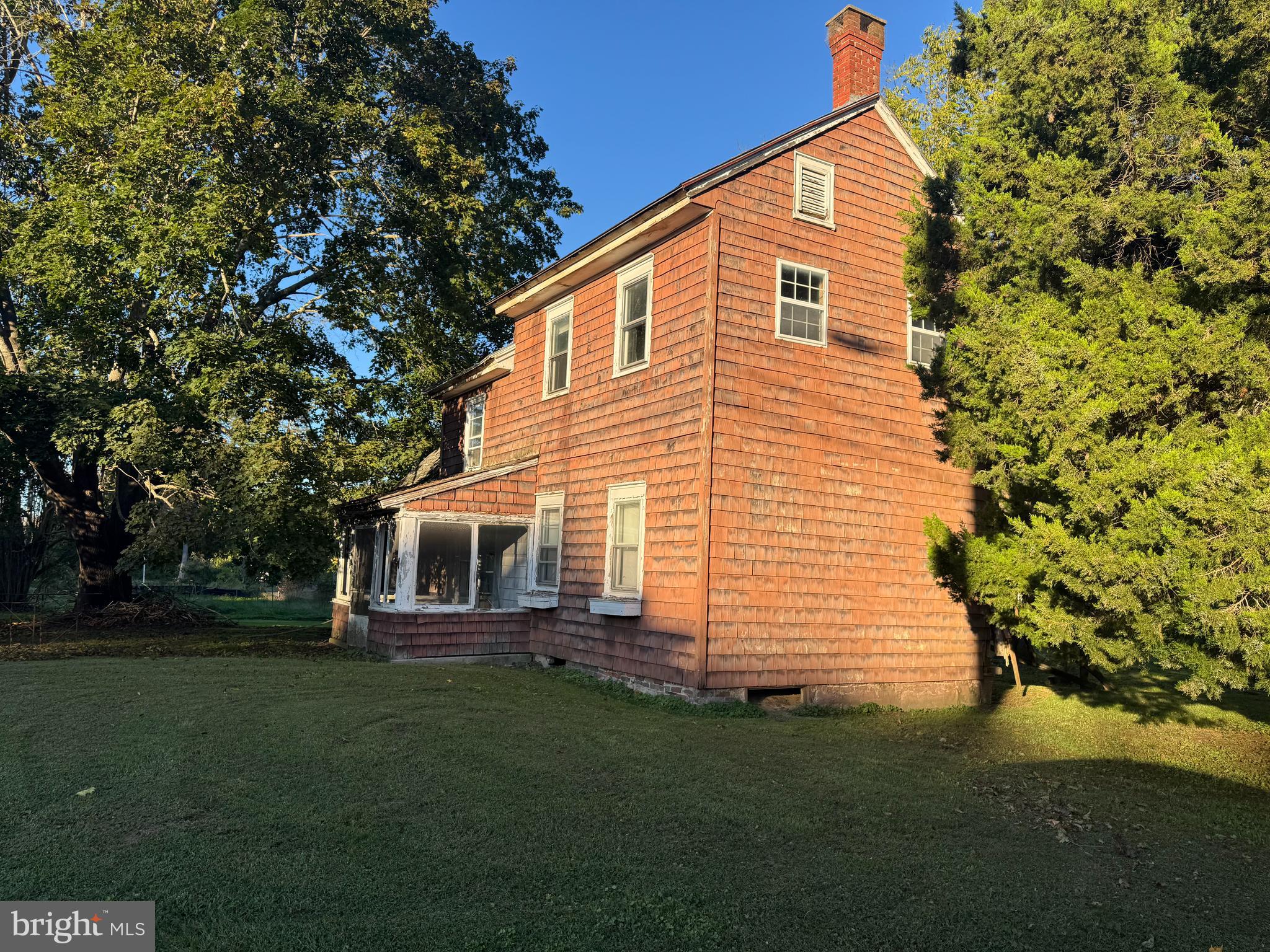 413 South Main Street Berlin, MD 21811 - Photo 2 of 3 a front view of a house with a garden