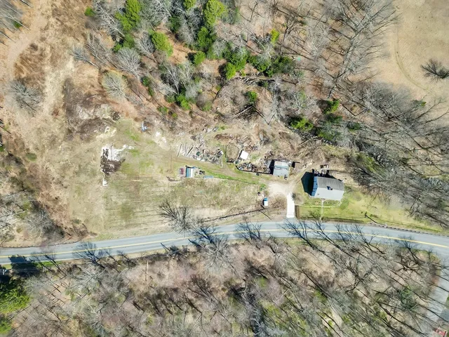 a view of outdoor space with trees all around