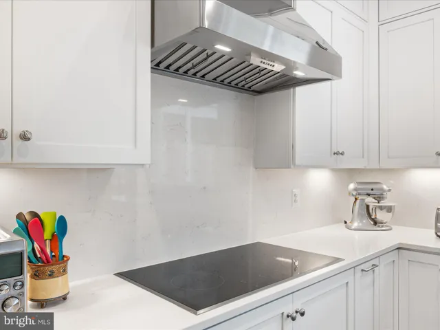 a spacious bedroom with a large bed and a large window