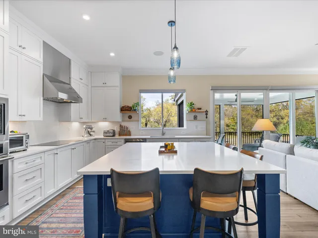 a bedroom with a large bed and a large window