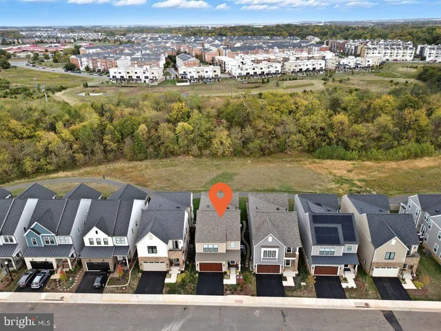 a view of a livingroom with wooden floor and a window