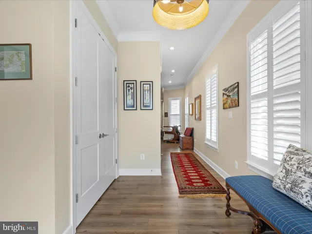 a dining room with furniture a rug and a chandelier