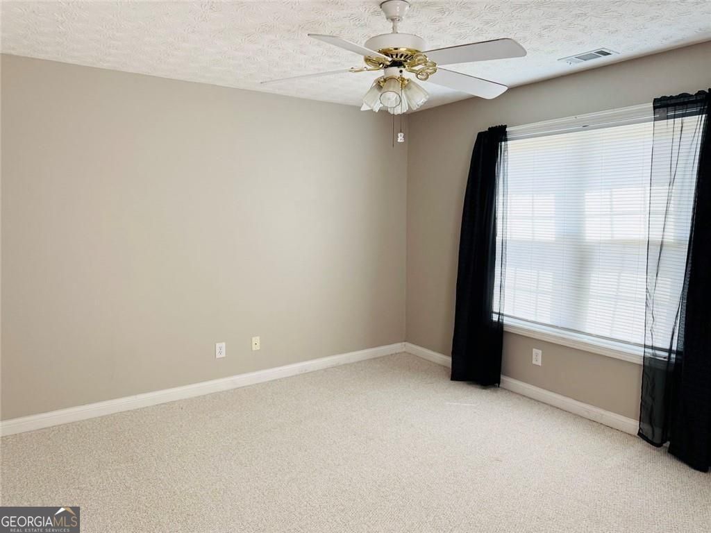 543 Saddle Ridge Drive Bethlehem, GA 30620 - Photo 25 of 36 wooden floor in an empty room with a window