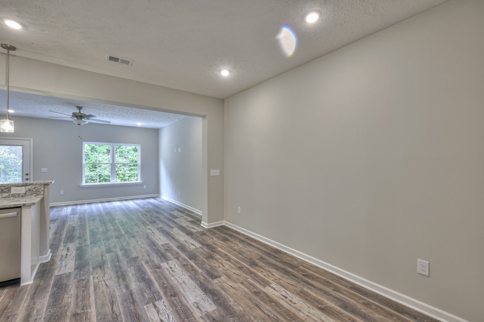 113 Creek Wood Road Manchester, TN 37355 - Photo 12 of 37 an empty room with wooden floor and windows