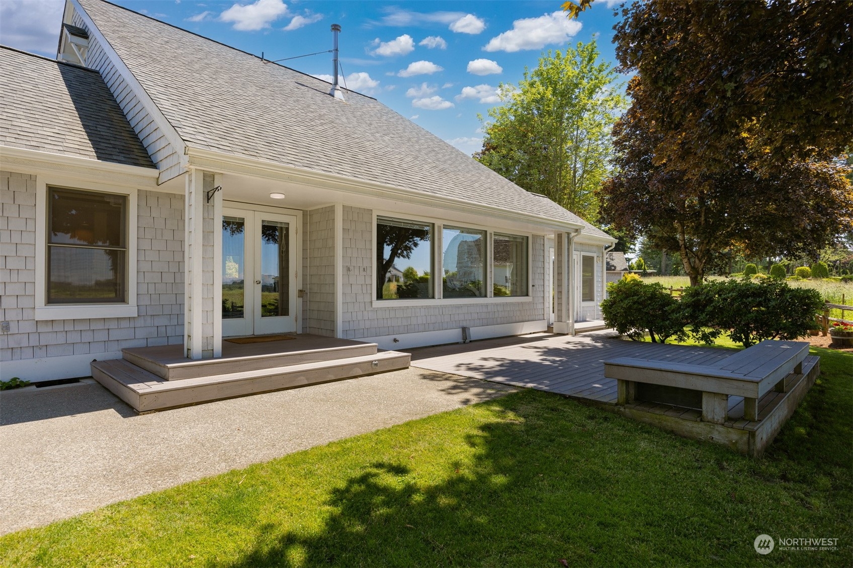 720 Van Dyk Road Lynden, WA 98264 - Photo 5 of 39 a view of a house with backyard and sitting area