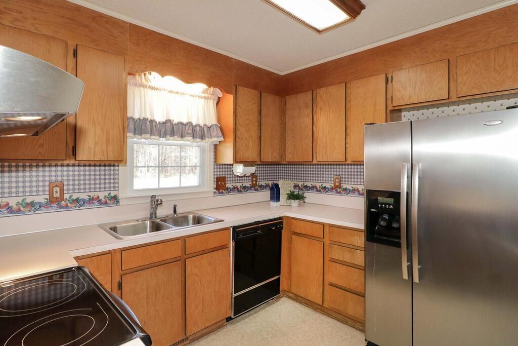 2245 Barger Road Salisbury, NC 28146 - Photo 11 of 48 a kitchen with a sink cabinets stainless steel appliances and a window