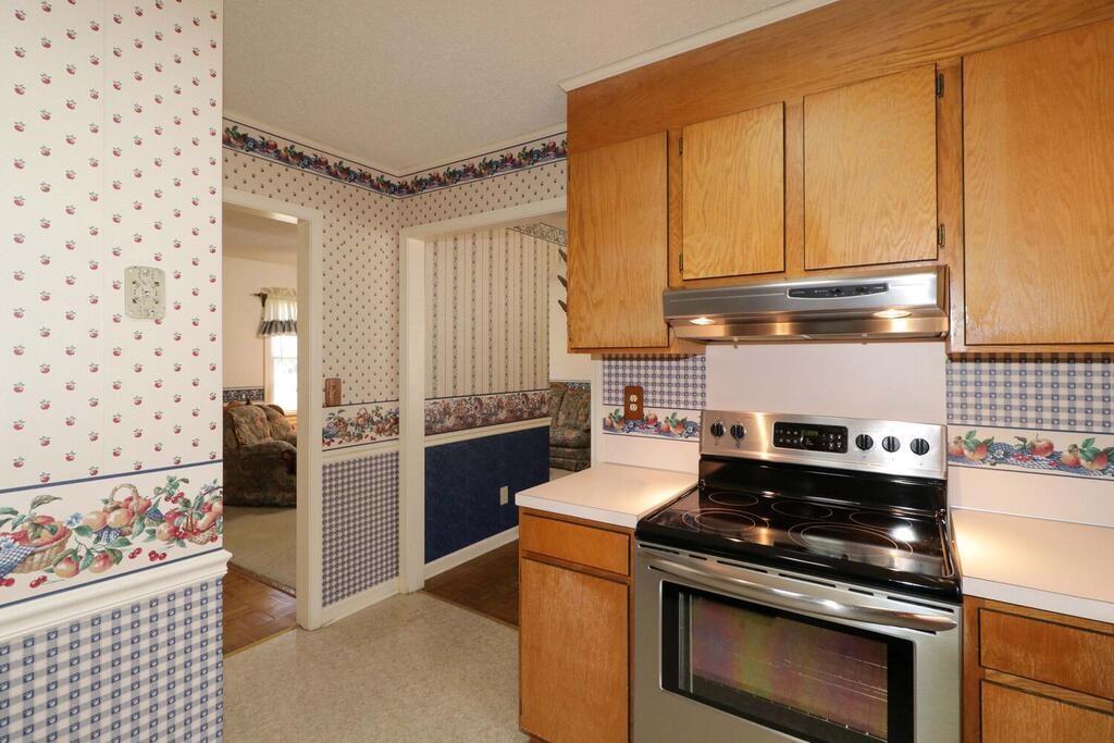 2245 Barger Road Salisbury, NC 28146 - Photo 13 of 48 a kitchen with a stove and a refrigerator
