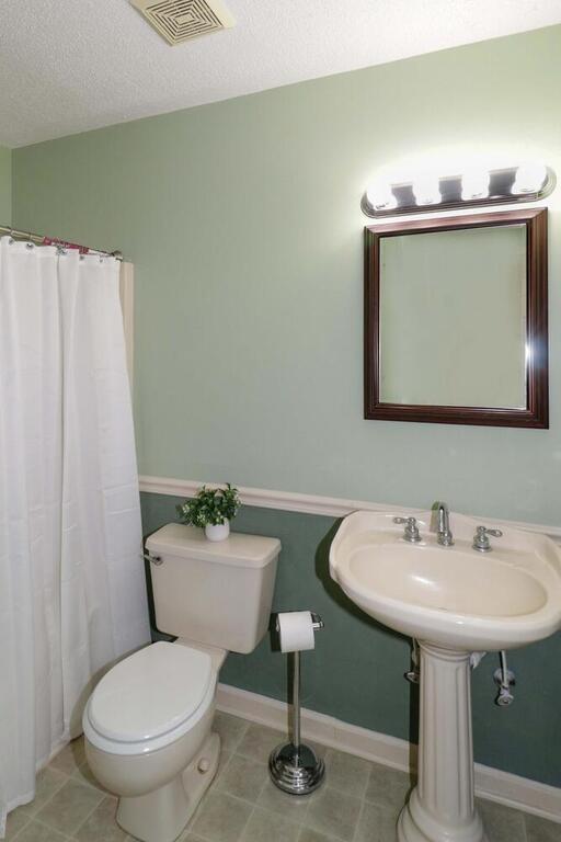 2245 Barger Road Salisbury, NC 28146 - Photo 19 of 48 a bathroom with a toilet sink and mirror