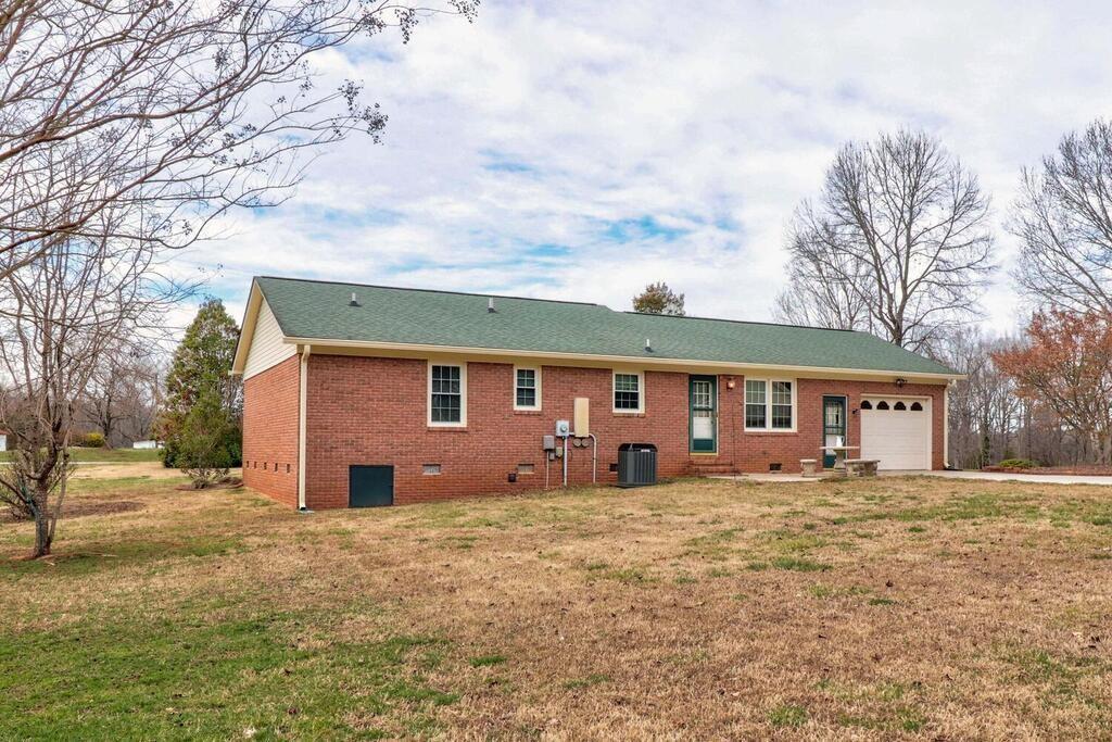2245 Barger Road Salisbury, NC 28146 - Photo 26 of 48 a house with large trees in front of it