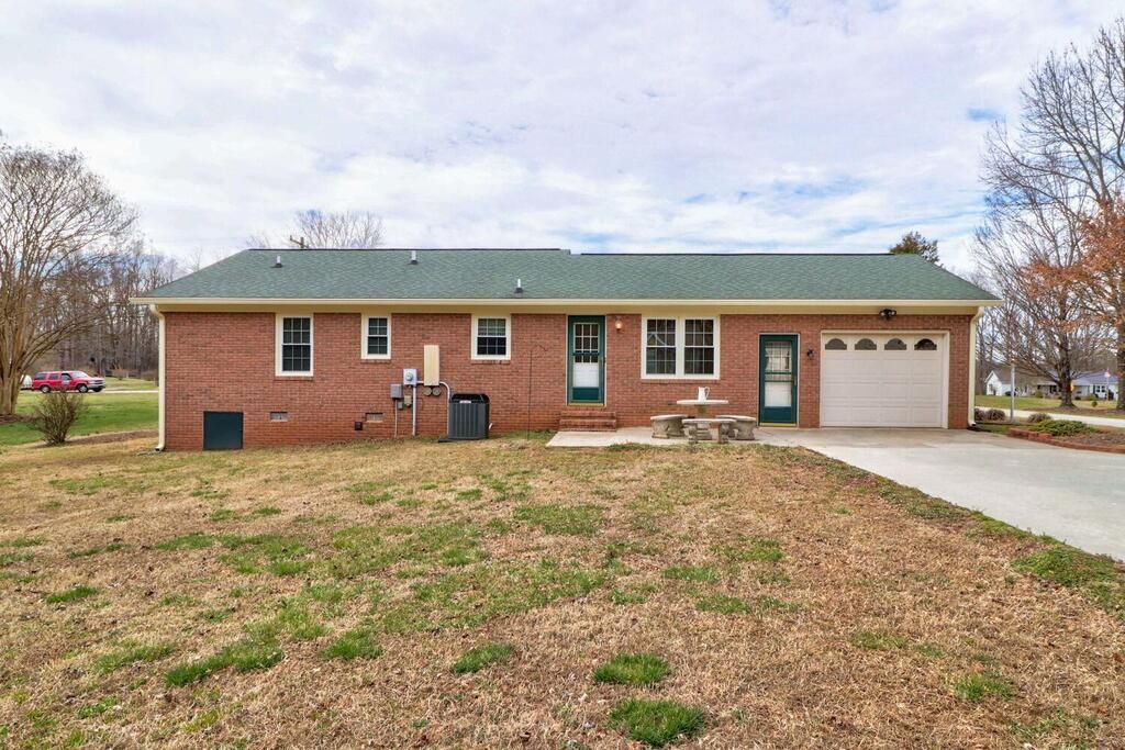 2245 Barger Road Salisbury, NC 28146 - Photo 27 of 48 a front view of a house with a yard and garage