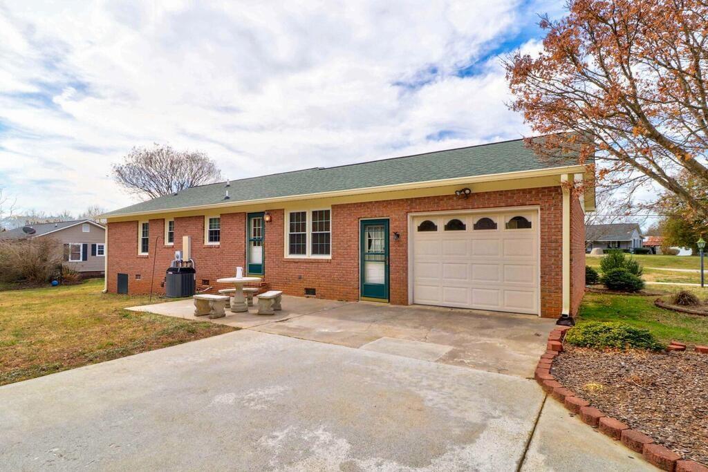 2245 Barger Road Salisbury, NC 28146 - Photo 29 of 48 a view of a house with backyard and a tree