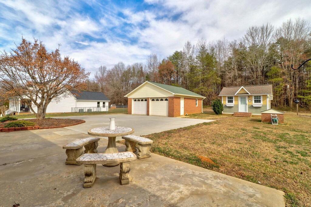 2245 Barger Road Salisbury, NC 28146 - Photo 30 of 48 a house with trees in front of it