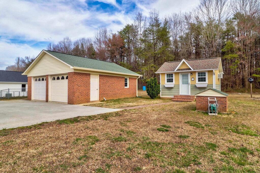 2245 Barger Road Salisbury, NC 28146 - Photo 31 of 48 a front view of a house with a garden and tree