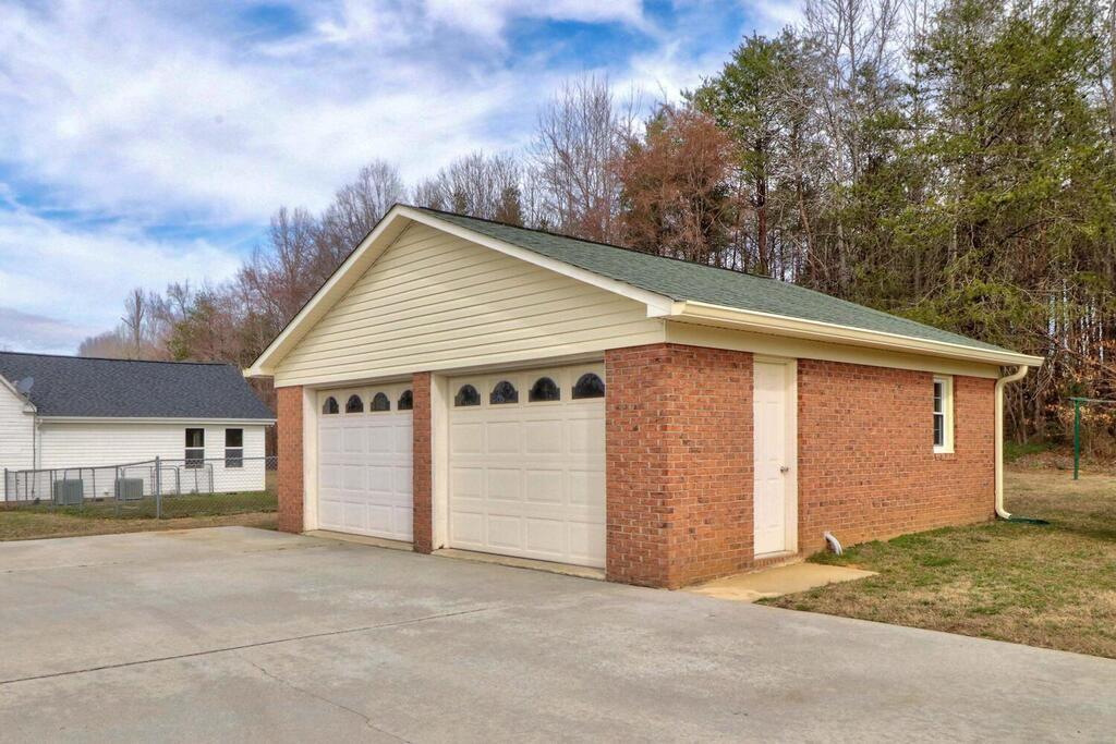 2245 Barger Road Salisbury, NC 28146 - Photo 32 of 48 a front view of a house with a garage
