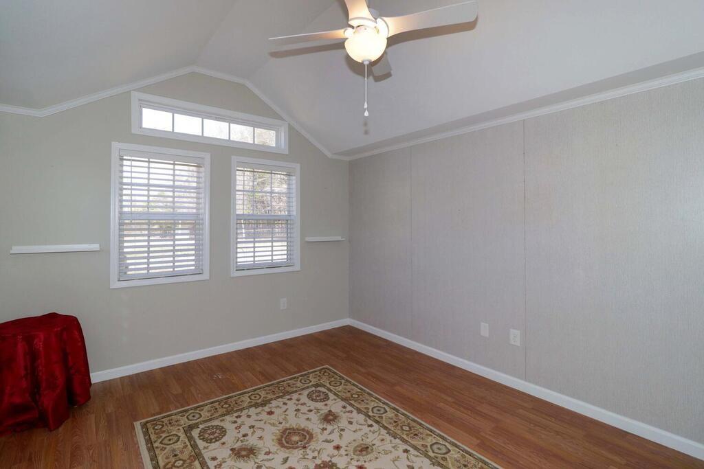 2245 Barger Road Salisbury, NC 28146 - Photo 39 of 48 a view of an empty room with wooden floor and a window