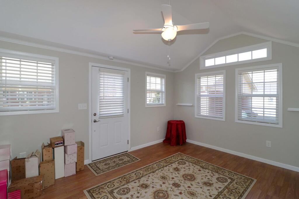 2245 Barger Road Salisbury, NC 28146 - Photo 40 of 48 a view of a livingroom with wooden floor and a ceiling fan