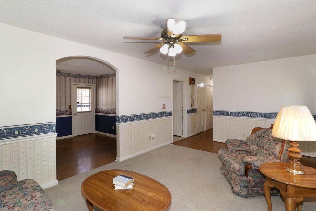 2245 Barger Road Salisbury, NC 28146 - Photo 9 of 48 a view of a livingroom with furniture and chandelier fan