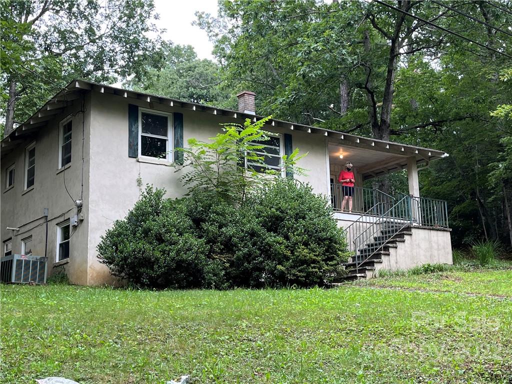 6 Rattlers Path Black Mountain, NC 28711 - Photo 2 of 2 a view of a house with a yard and sitting area