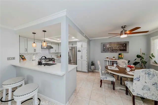a kitchen with a refrigerator a sink and a stove