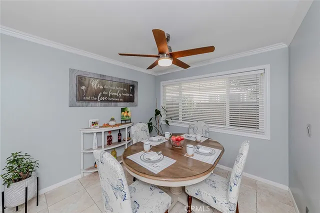 a kitchen that has a refrigerator and a sink