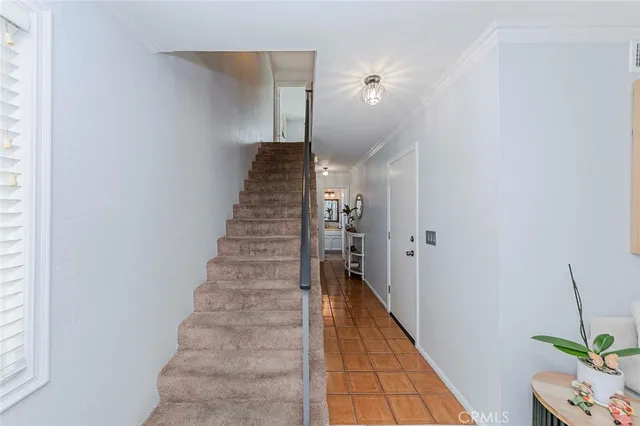 a room that has a bed and a chair in it